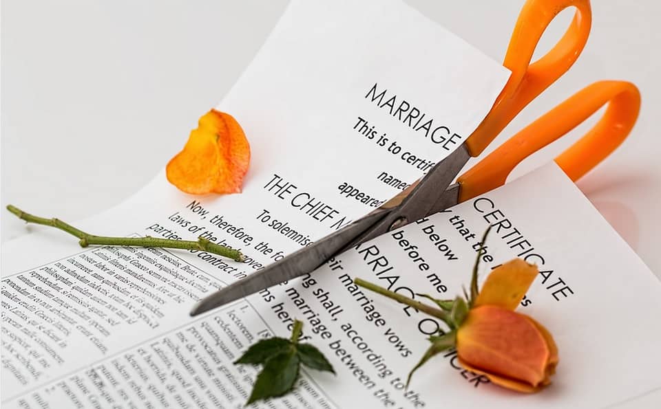 a marriage certificate being shredded